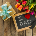Father receiving Father’s Day flowers and gifts from family in Vaughan