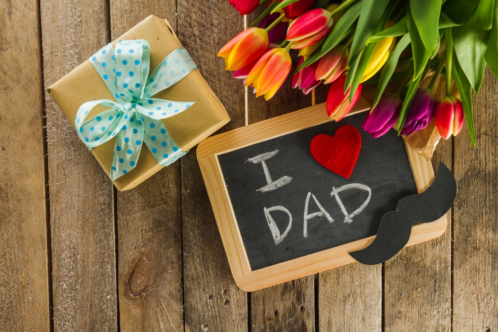 Father receiving Father’s Day flowers and gifts from family in Vaughan