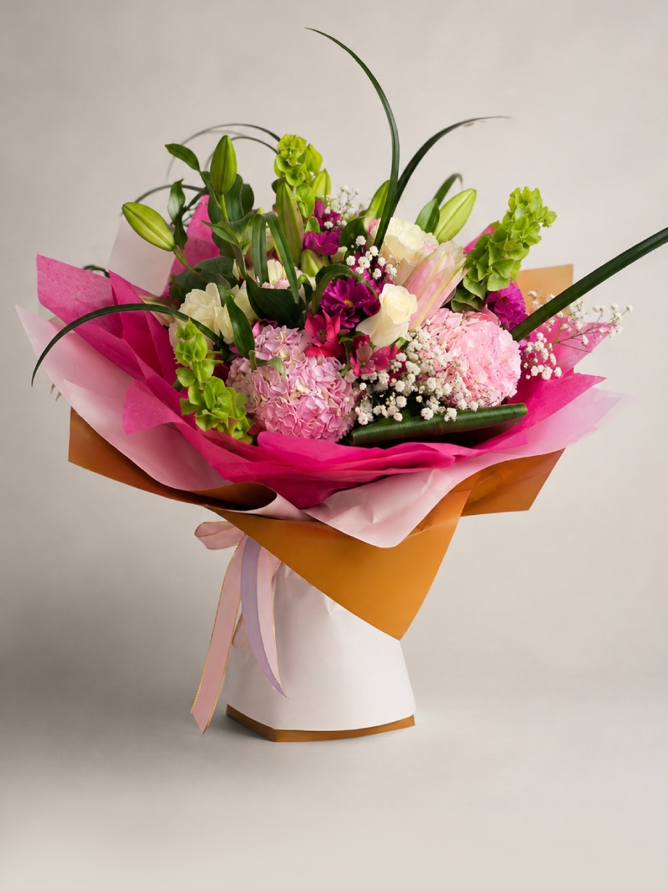 Florist preparing a fresh flower arrangement at Making Dream Florist